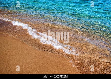 Turquoise clear water in sea and sandy beach at exotic tropical resort Stock Photo