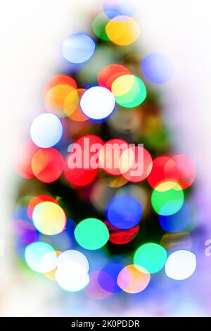 blur light colorful bokeh celebration and defocused lights decoration on christmas tree at white background Stock Photo