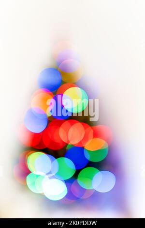 blur light colorful bokeh celebration and defocused lights decoration on christmas tree at white background Stock Photo