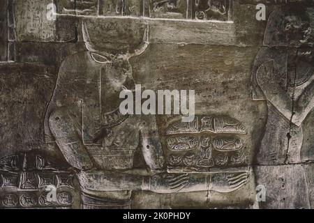 View to an Ancient Egyptian Drawing on the Walls of the Dendera Temple complex in south-east of Dendera, Egypt Stock Photo