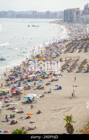 Crowded beach  with parasols busy beach, Fuengirola, Los Boliches, Andalusia, Costa del Sol, Spain. Stock Photo