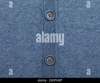 Blue melange knitted fabric made of heather mixed yarn with plastic buttons Stock Photo
