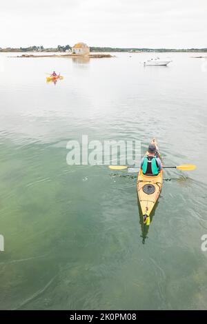 Middle-aged person kayaking on the lake Stock Photo