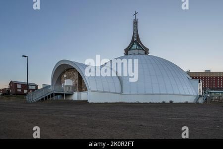 Sunrise on the igloo shaped St. Jude’s Anglican Cathedral in Iqaluit, Nunavut Stock Photo