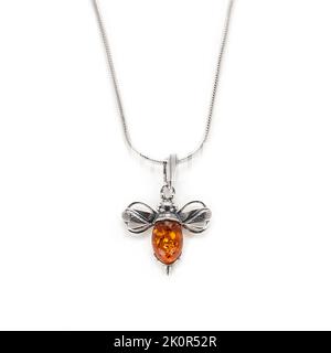 Amber jewellery set in a variety of different fittings from Octopus to bees. 925 silver.  Shot on white backgrounds. Stock Photo