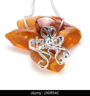 Amber jewellery set in a variety of different fittings from Octopus to bees. 925 silver.  Shot on white backgrounds. Stock Photo
