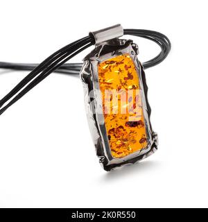 Amber jewellery set in a variety of different fittings from Octopus to bees. 925 silver.  Shot on white backgrounds. Stock Photo