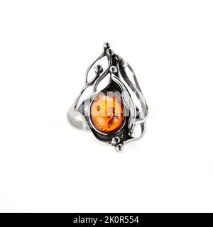 Amber jewellery set in a variety of different fittings from Octopus to bees. 925 silver.  Shot on white backgrounds. Stock Photo