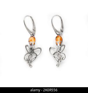 Amber jewellery set in a variety of different fittings from Octopus to bees. 925 silver.  Shot on white backgrounds. Stock Photo