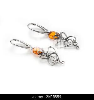 Amber jewellery set in a variety of different fittings from Octopus to bees. 925 silver.  Shot on white backgrounds. Stock Photo