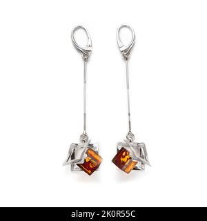 Amber jewellery set in a variety of different fittings from Octopus to bees. 925 silver.  Shot on white backgrounds. Stock Photo
