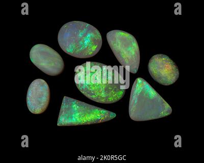 Australian Opal gemstones, shot on a black background to highlight the gorgeous colour and pattern of this natural stone. Project with Damien Hirst. Stock Photo