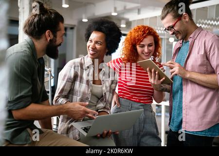 Programmers cooperating at IT company developing apps. People business work office concept Stock Photo