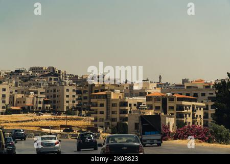 06.18.2022. Amman, Jordan. beautiful view of the city and cars moving on the road. High quality photo Stock Photo