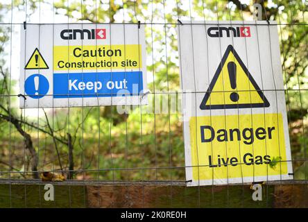 warning sign of live gas on construction site united kingdom Stock Photo