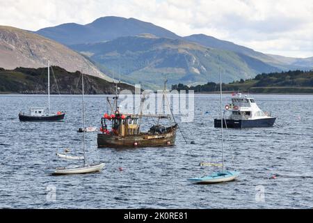 An old fishing boat moored in Ullapool Bay on Loch Broom, Sutherland, Scotland, UK Stock Photo