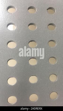 Detail of a perforated sheet Stock Photo