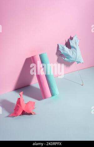 pink-blue chalk with autumn leaves paint on a blue-pink background. Stock Photo