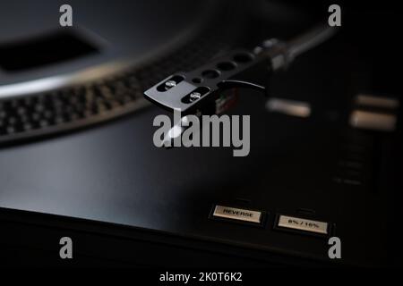 Turntables needle cartridge on tone arm. Professional dj turntable player for vinyl records Stock Photo