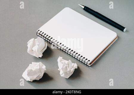 Open blank notepad, pen and crumpled paper on office desk. Education or business creative concept background Stock Photo