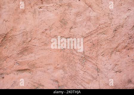 Dusty pink rose texture of concrete. An old concrete wall painted with pink paint. Rose concrete background. Stock Photo