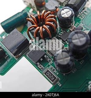 Macro photo of an electronic circuit board of a portable charger with selective focus Stock Photo