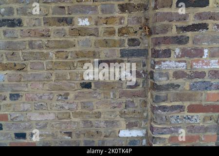 Facade evenly laid stones brick wall ashlar rails different colored as background concept for bricks walls, old buildings and bricks Stock Photo