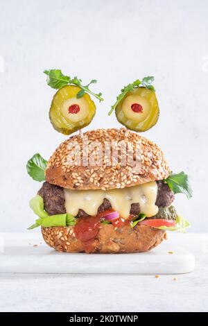 Halloween burger in shape of scary monster Stock Photo