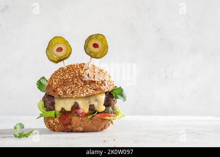 Halloween burger in shape of scary monster Stock Photo