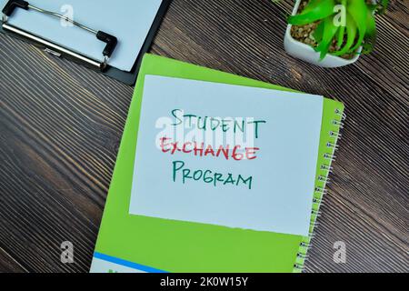 Concept of Student Exchange Program write on sticky notes isolated on Wooden Table. Stock Photo