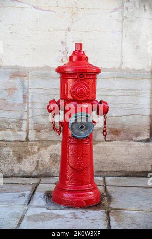 Close-up of a red fire hydrant in the city Stock Photo