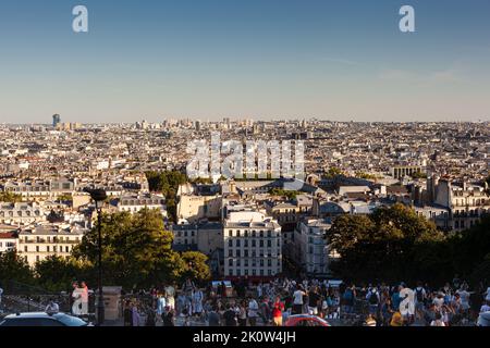 Paris, France - July, 15: Crowd at the staircase looking the city of Paris from its highest point in Montmartre on July 15, 2022 Stock Photo