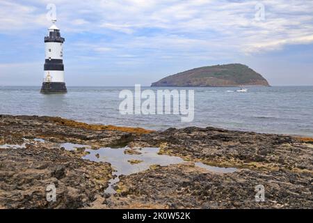 Penmon Lighthouse or Trwyn Du Lighthouse and Puffin Island, Penmon, Isle of Anglesey, Ynys Mon, North Wales, UK. Stock Photo
