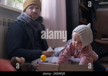 Man wearing warm clothing feeling cold . Energy crisis in Europe Stock Photo