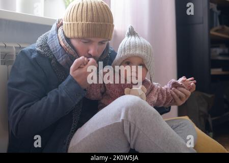 Man wearing warm clothing feeling cold . Energy crisis in Europe Stock Photo