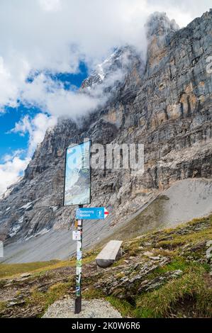 Sign on the Eiger Trail, under the North Side of the Mountain Stock Photo