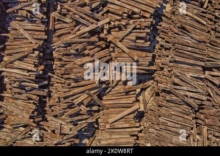 Aerial view of stacked old wooden railway sleepers Stock Photo