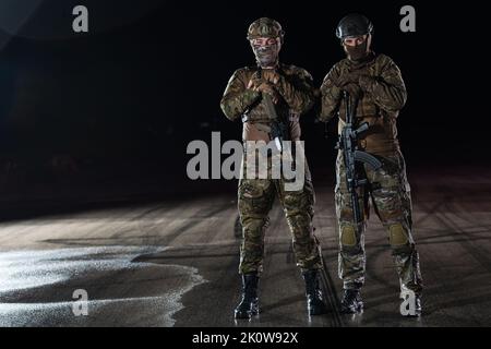 soldiers squad in night mission Stock Photo