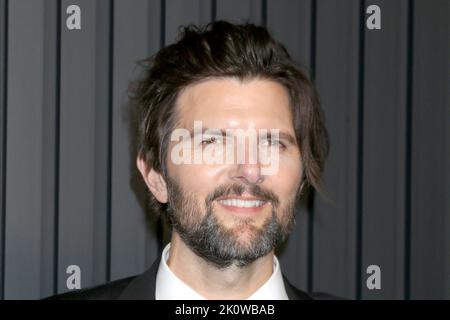 LOS ANGELES - SEP 12:  Adam Scott at the Apple TV+ Primetime Emmy Party Red Carpet at Mother Wolf  on September 12, 2022 in Los Angeles, CA Stock Photo