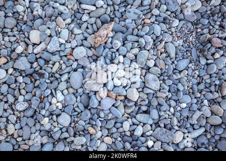 Stones pattern. Decorative white grey blue stones, round stones background , Stones or Gravel for building, floor or wall. Pebbles Texture Stock Photo