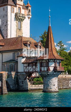 The castle of Oberhofen, situated on the bank of the Thunersee in Canton of Bern, Switzerland Stock Photo