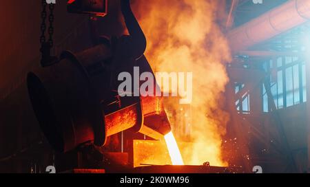 Process of Casting in Foundry. Steel Mill metallurgical Factory. Molten metal. Heavy Industry. Stock Photo