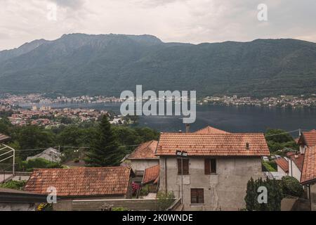 High angle view of the town of Brolo, Piedmont, Italy. On the background lay Orta lake and the city of Omegna. Copy space. Stock Photo