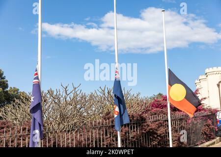 Death of Queen Elizabeth II, in Sydney flags fly at half mast outside the Conservatorium of Music on Macquarie street,Sydney city centre,NSW,Australia Stock Photo