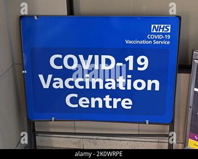 COVID-19 NHS Vaccination Centre sign, Bolton, greater Manchester, England, UK, BL1 Stock Photo