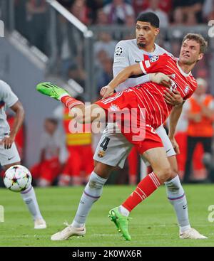 Munich, Germany. 13th Sep, 2022. Ronald Araujo (L) of Barcelona vies with Thomas Mueller of Bayern Munich during the UEFA Champions League Group C match between Bayern Munich and FC Barcelona in Munich, Germany, on Sept. 13, 2022. Credit: Philippe Ruiz/Xinhua/Alamy Live News Stock Photo