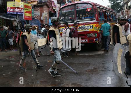 Kolkata, West Bengal, India. 13th Sep, 2022. Hundreds of BJP (Bharatiya Janata Party) supporters from across West Bengal arrived in Kolkata and neighbouring Howrah this morning to take part in the 'Nabanna Abhijan' or march to secretariat. Several BJP leaders in West Bengal, including Leader of the Opposition Suvendu Adhikari, were detained by the police today when they were marching to the state secretariat 'Nabanna' in Kolkata, as part of a huge protest over alleged corruption by the ruling Trinamool Congress government. Several BJP workers were detained by the police following the clas Stock Photo