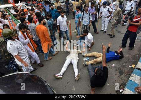 BJP (Bharatiya Janata Party) supporters seated on the road to protest corruption by Mamata Banerjee-led Government before start Nabanna Abhijan. The BJP has organized the mega ‘Nabanna Cholo' rally to protest against the alleged corrupt practices of the Mamata Banerjee-led government in Bengal. As per the BJP's plan, rallies from three points have been tried to reach the state secretariat. The one from Howrah Maidan which was led by Sukanta Majumdar. Another from Satraganchi, led by Suvendu Adhikari and Dilip Ghosh led workers for the third rally from College Street. (Photo by Suraranjan Nandi Stock Photo