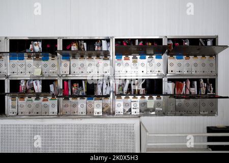 Wall mounted mailboxes in an apartment building. This building has since been demolished. Stock Photo