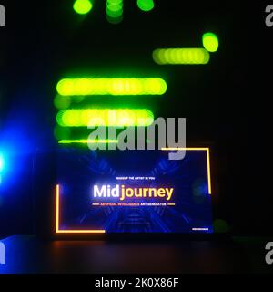 AI Midjourney logo on the phone screen on the background of the server room. Smartphone with artificial intelligence neural network logo - Moscow, Rus Stock Photo
